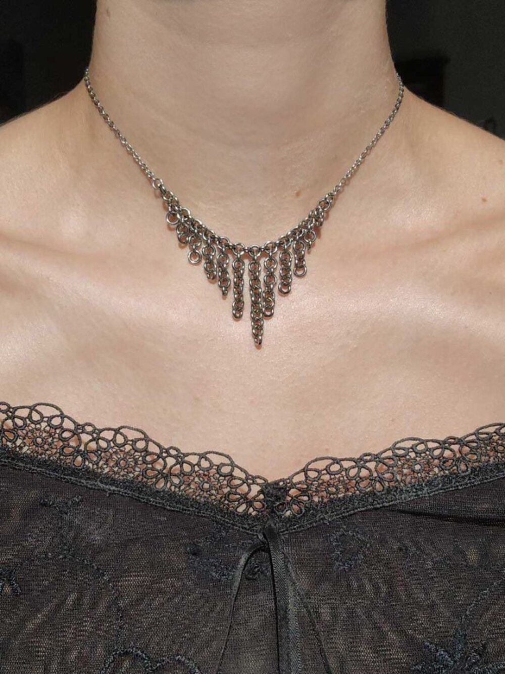 Gothic V-shaped silver waterfall choker necklace with a small silver chain